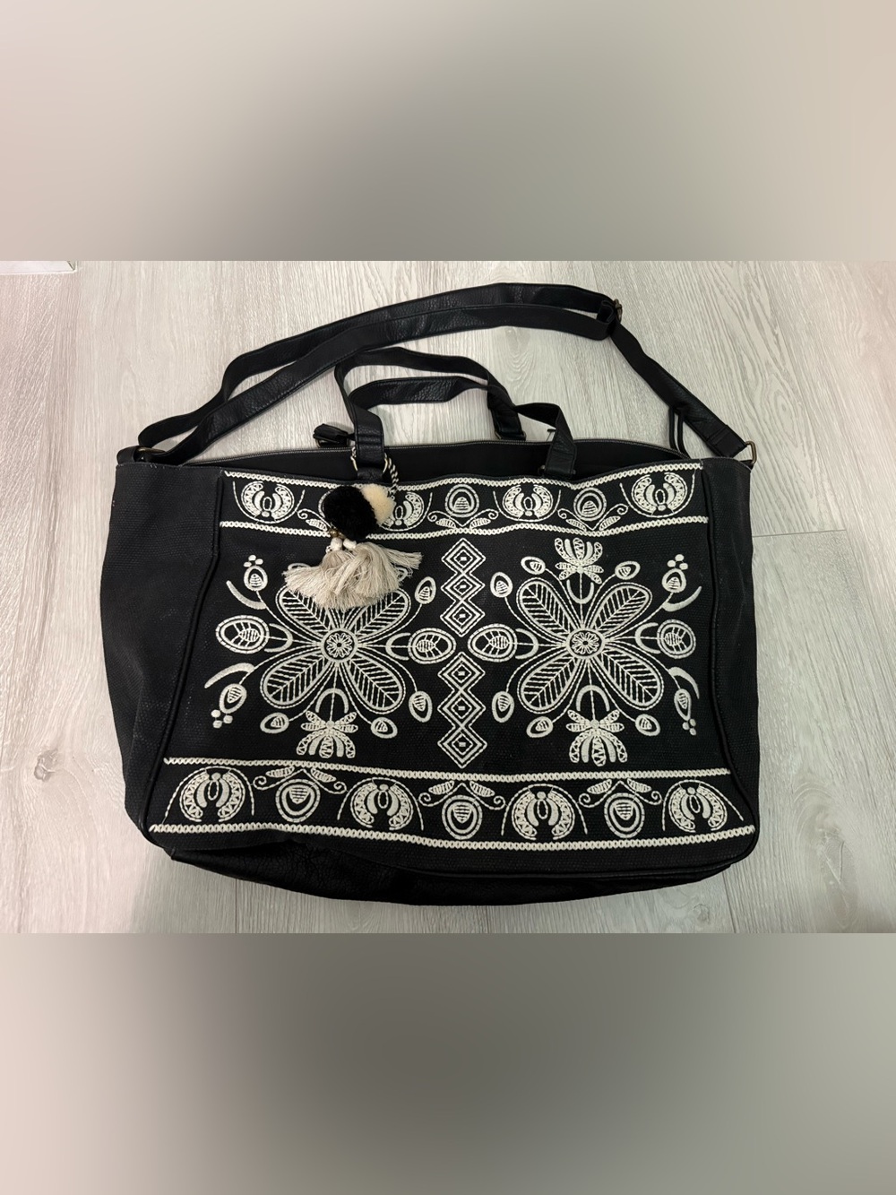 Embroidered Black Tote Bag with Cream Tassel Accent